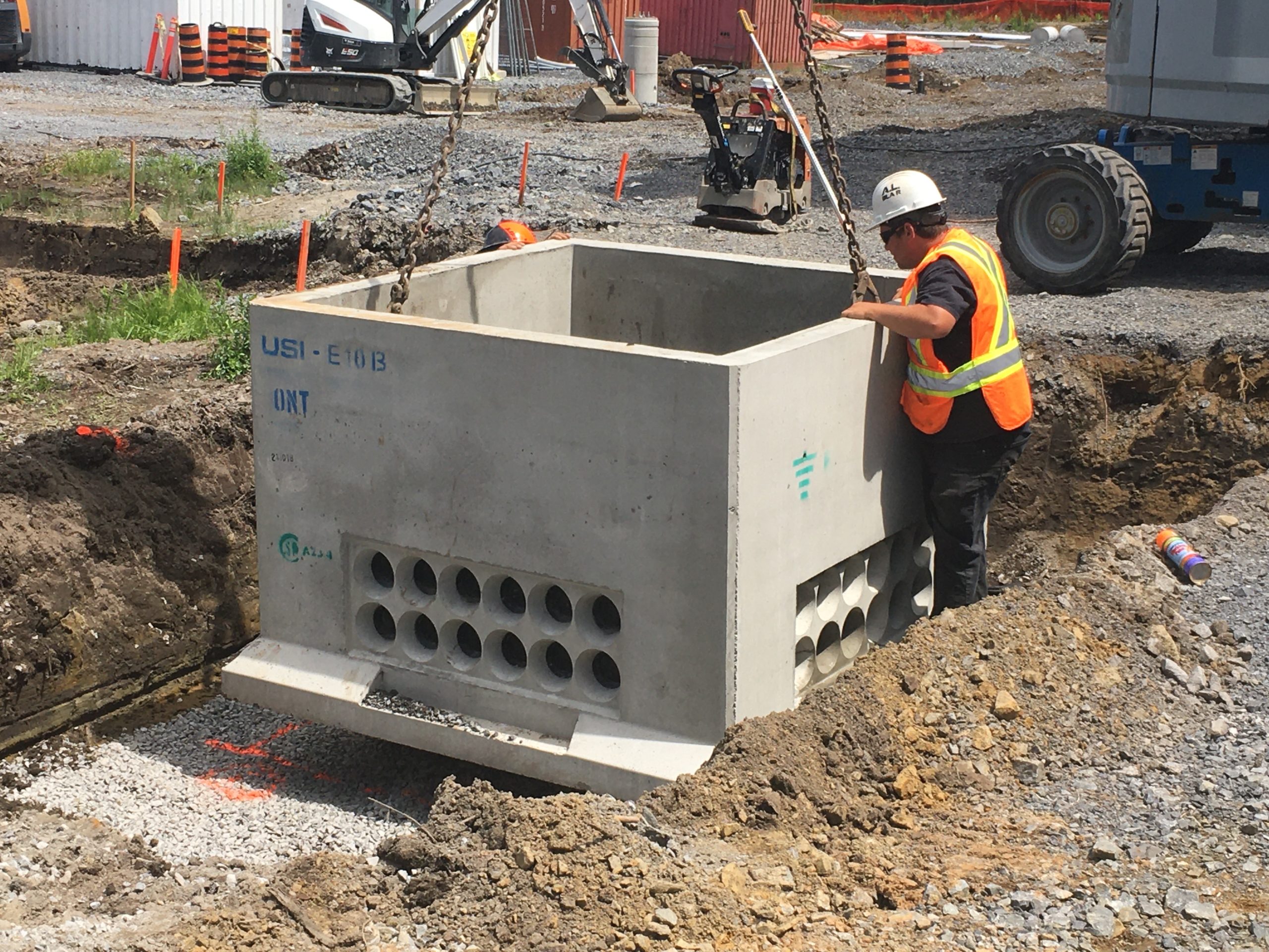 Outdoor service cement box being installed